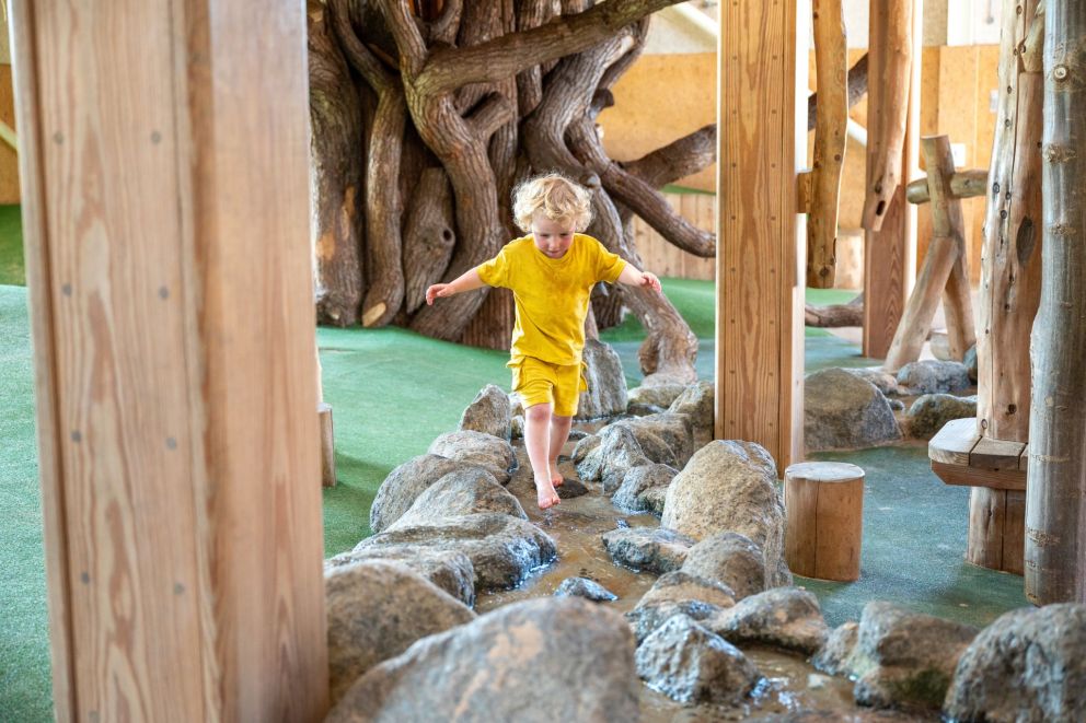 little boy in the indoor stream