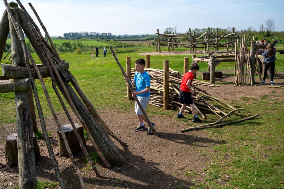Two boys building a Den together