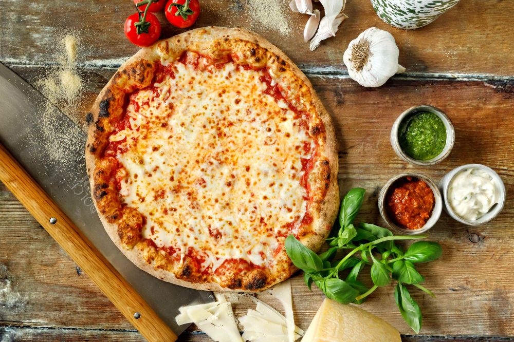 Pizza in East Yorkshire served fresh from the wood-fired oven, with families enjoying delicious handmade pizzas at Williams Den.