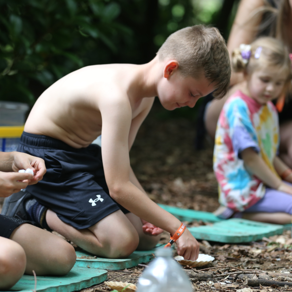 little boy creating fire