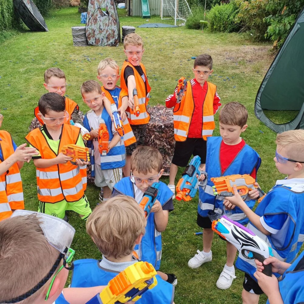 group of boys with nerf blasters
