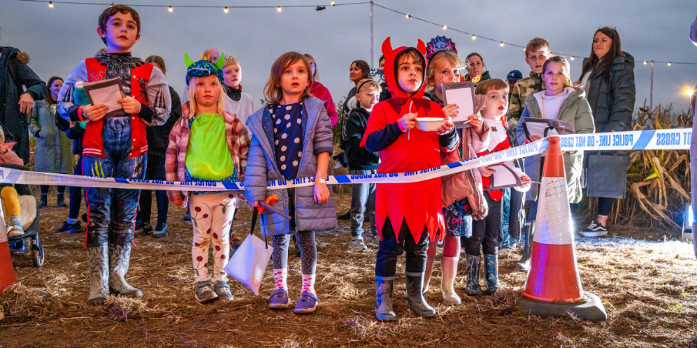kids stood watching performance
