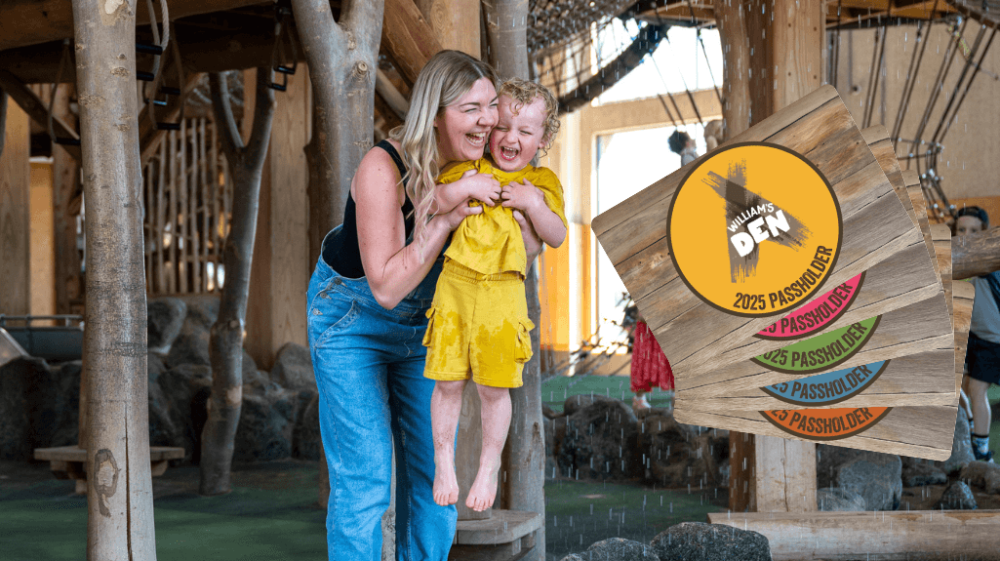 Mother and son having fun in the rain maker - annual passes on display