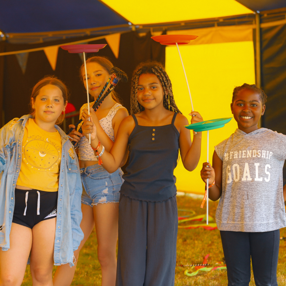four girls with circus props