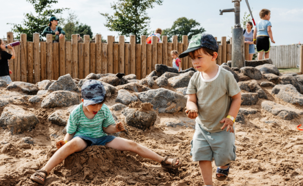 boys playing in sand area