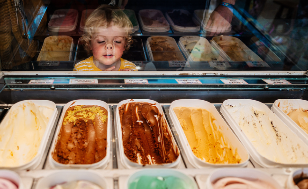 little boy looking at ice cream